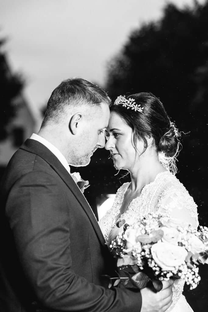 Bride and groom sharing an intimate moment on their wedding day in East Kilbride