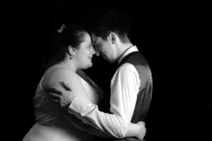 Bride and groom embrace in a romantic black and white portrait at their wedding in Northallerton