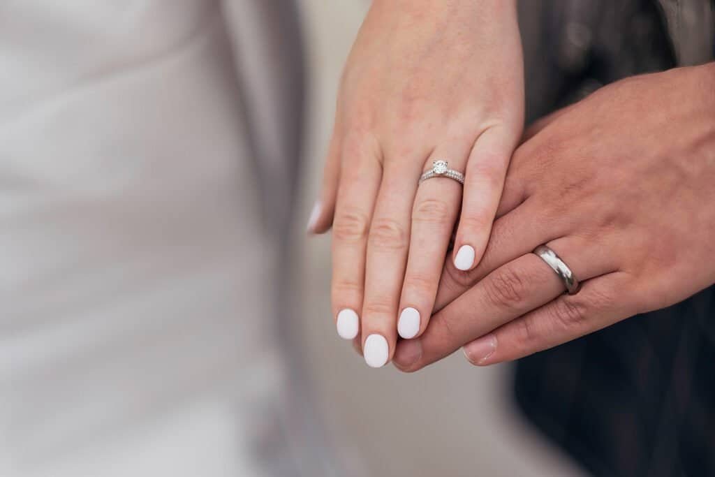 Hands of a couple with wedding rings on their fingers
