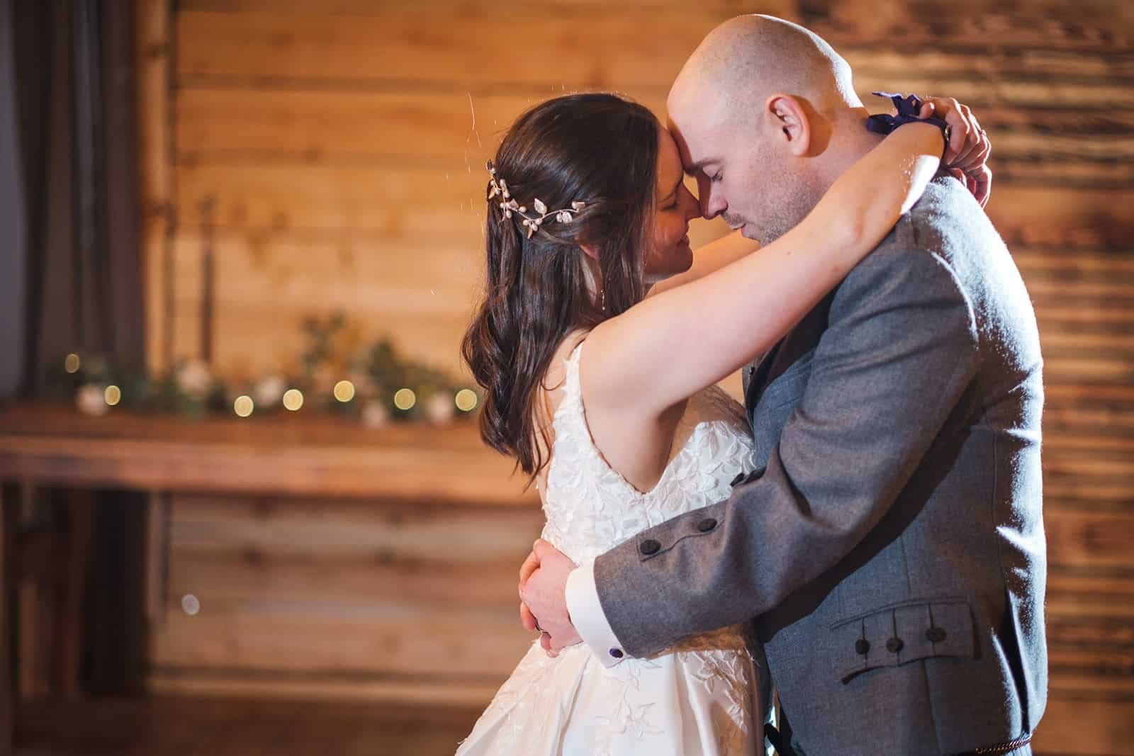 Bride and groom share a romantic first dance together