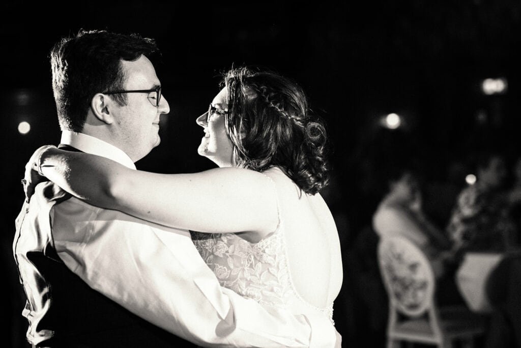 Couple shares a joyful first dance at their wedding reception