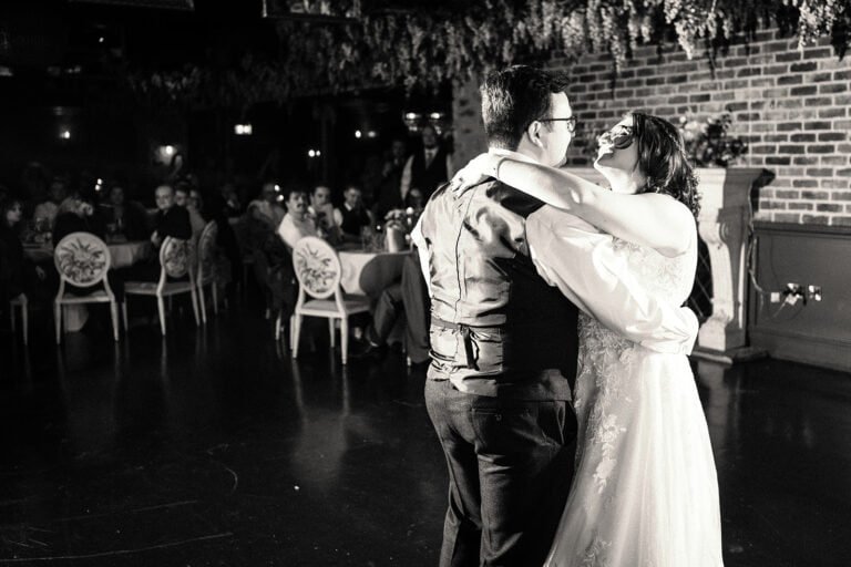 Bride and groom share first dance at wedding reception