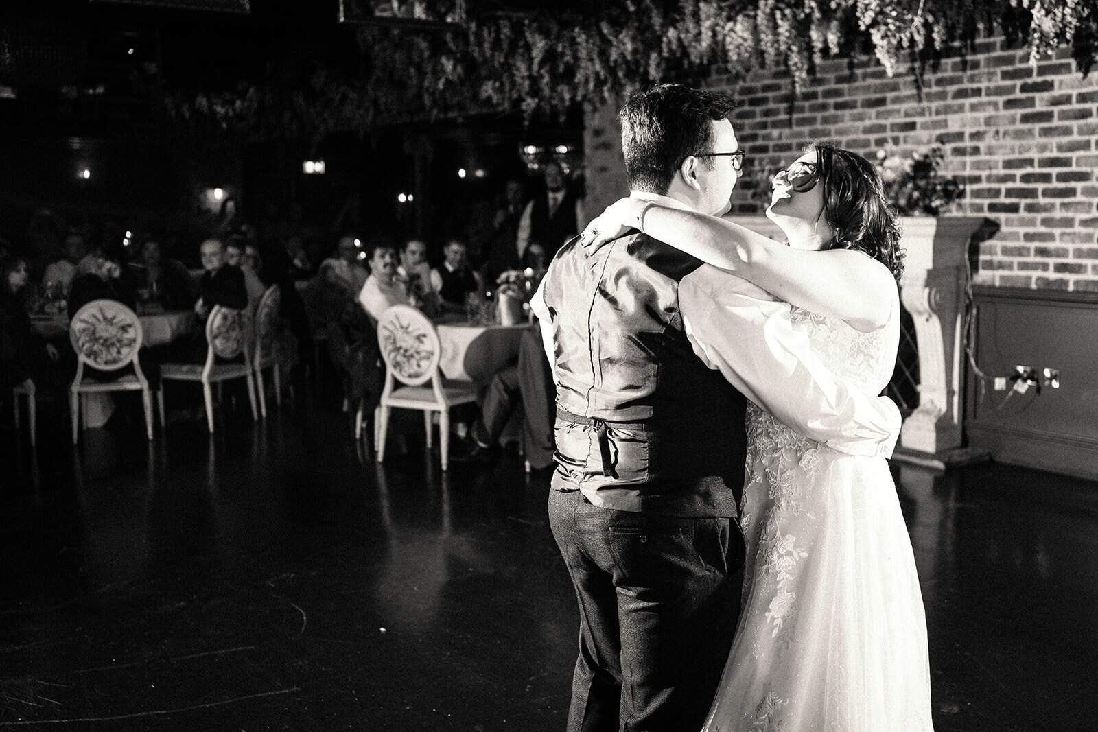 Bride and groom share first dance at wedding reception