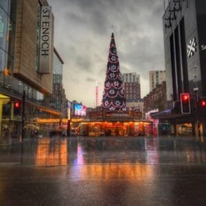Glasgow City Christmas Market with festive Christmas tree and holiday lights.