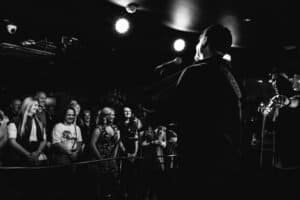 Live acoustic performance in a dimly lit intimate venue