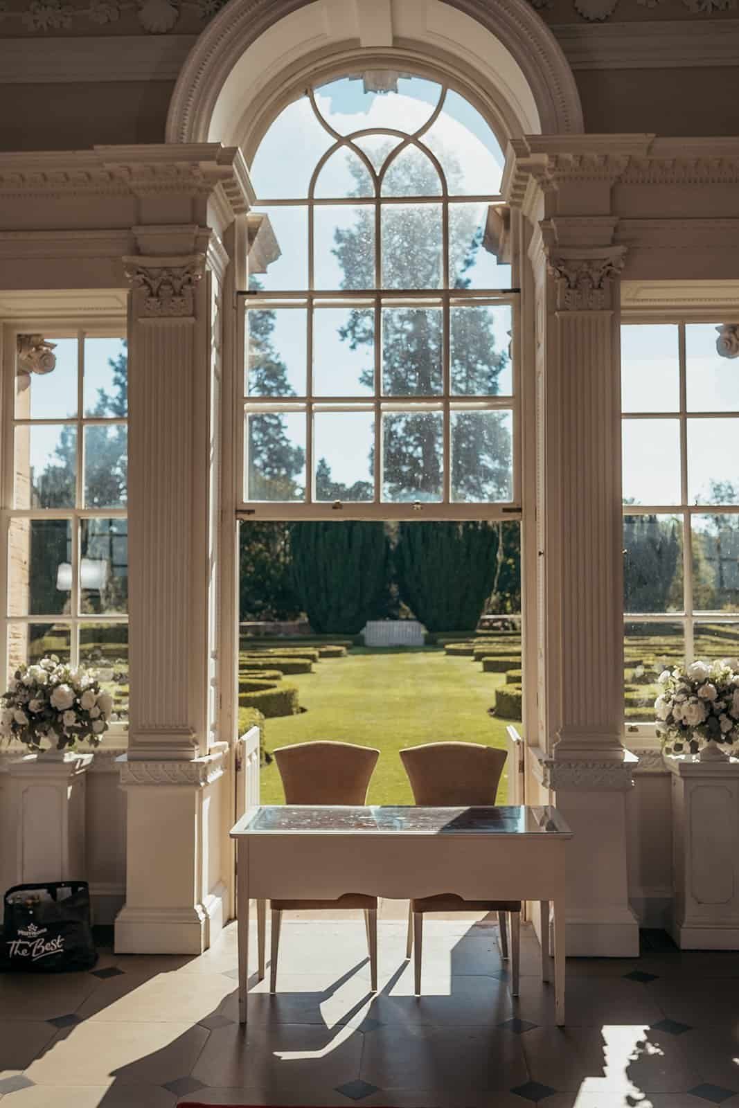 Elegant room at Chatelherault with large window overlooking a manicured garden