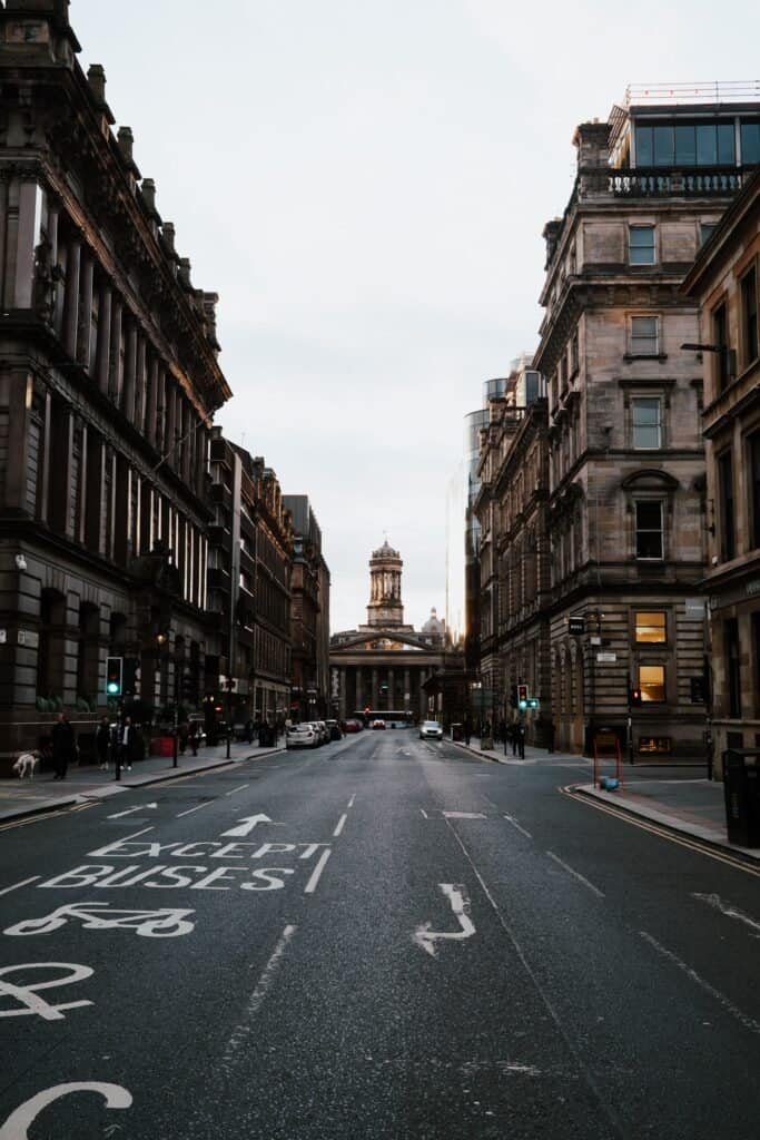 A historic Glasgow street looking towards the Gallery of Modern Art at dusk