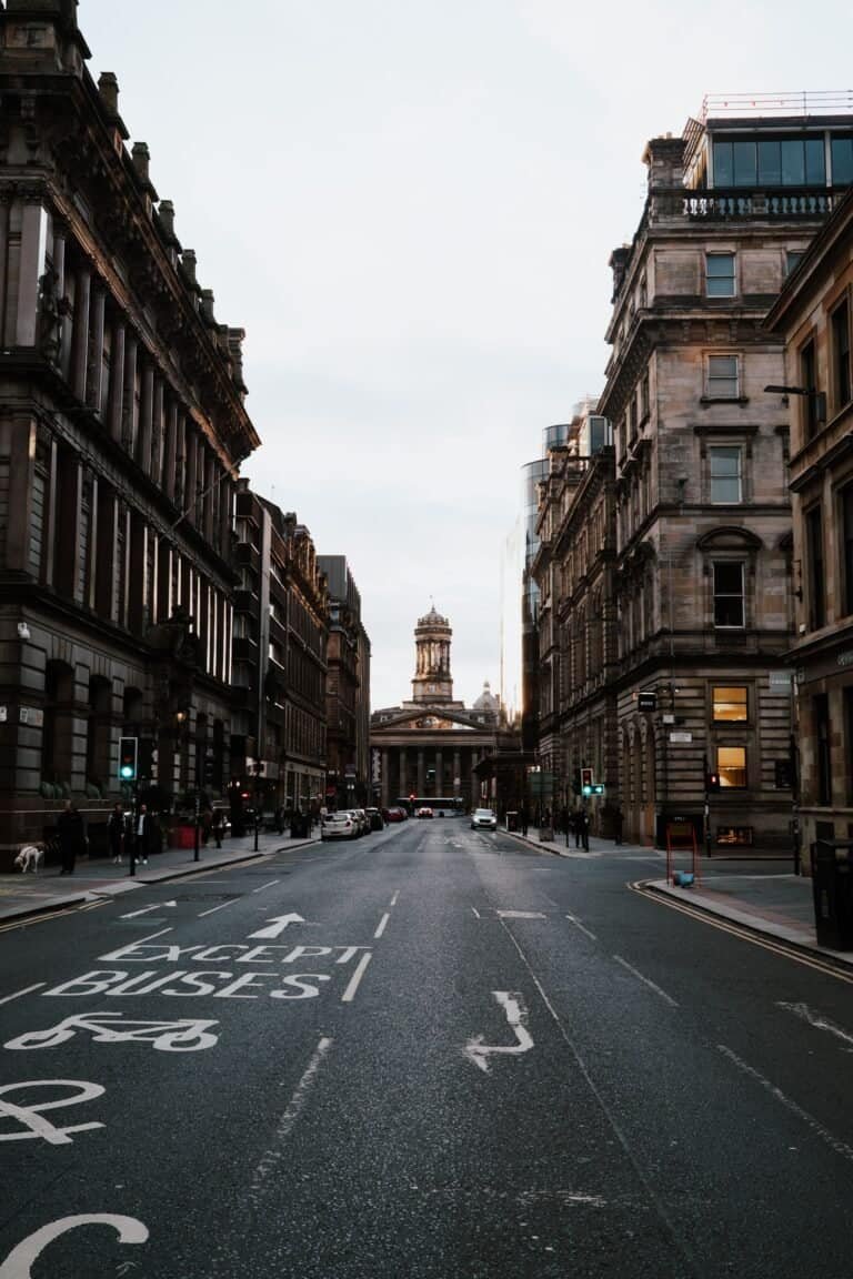 A historic Glasgow street looking towards the Gallery of Modern Art at dusk